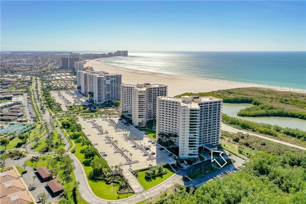 Bird's eye view of expansive coastline and apartment complex / building