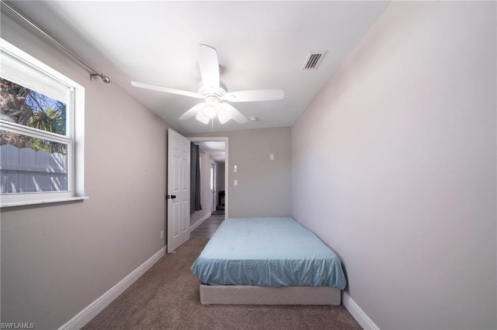 Bedroom featuring carpet floors and ceiling fan