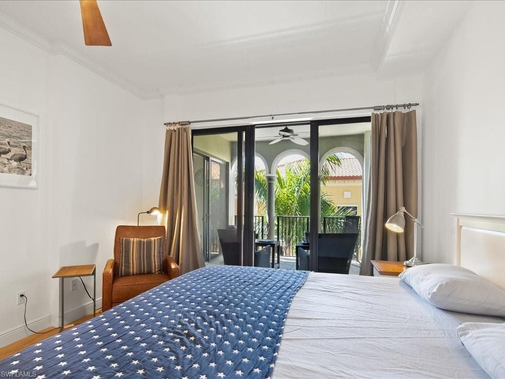 Bedroom with access to exterior, ceiling fan, and crown molding