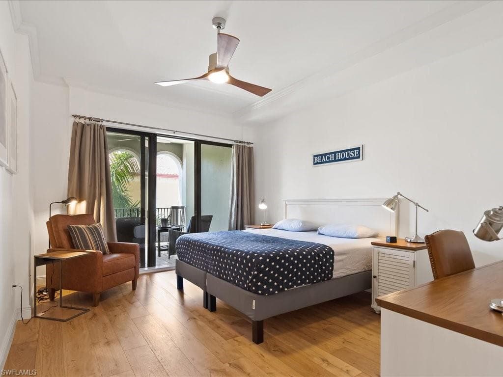 Bedroom featuring light wood-style floors, access to exterior, and a ceiling fan