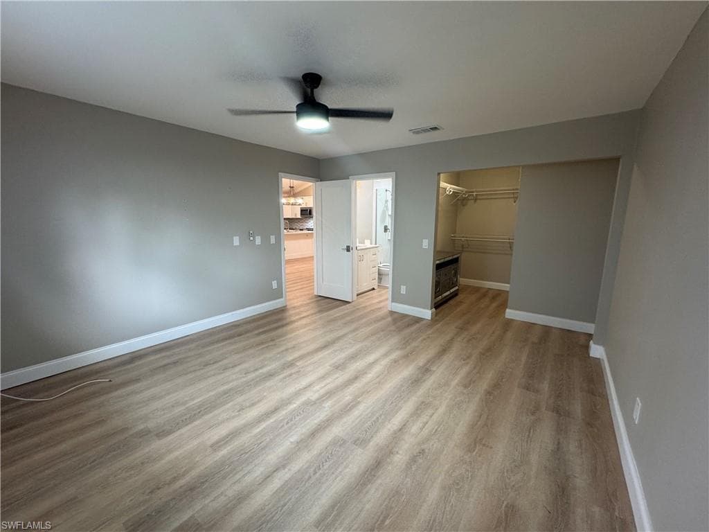 MASTER BEDROOM SHOWING WALK IN CLOSET AND BATH