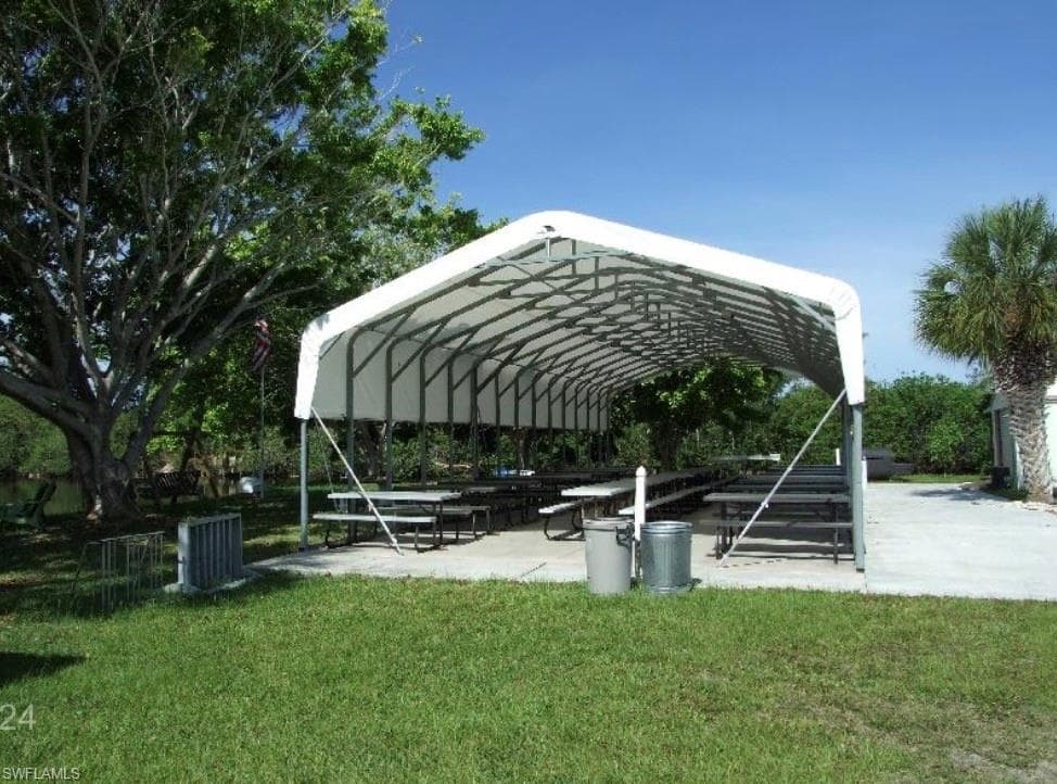 View of property's community featuring a patio area and a pergola