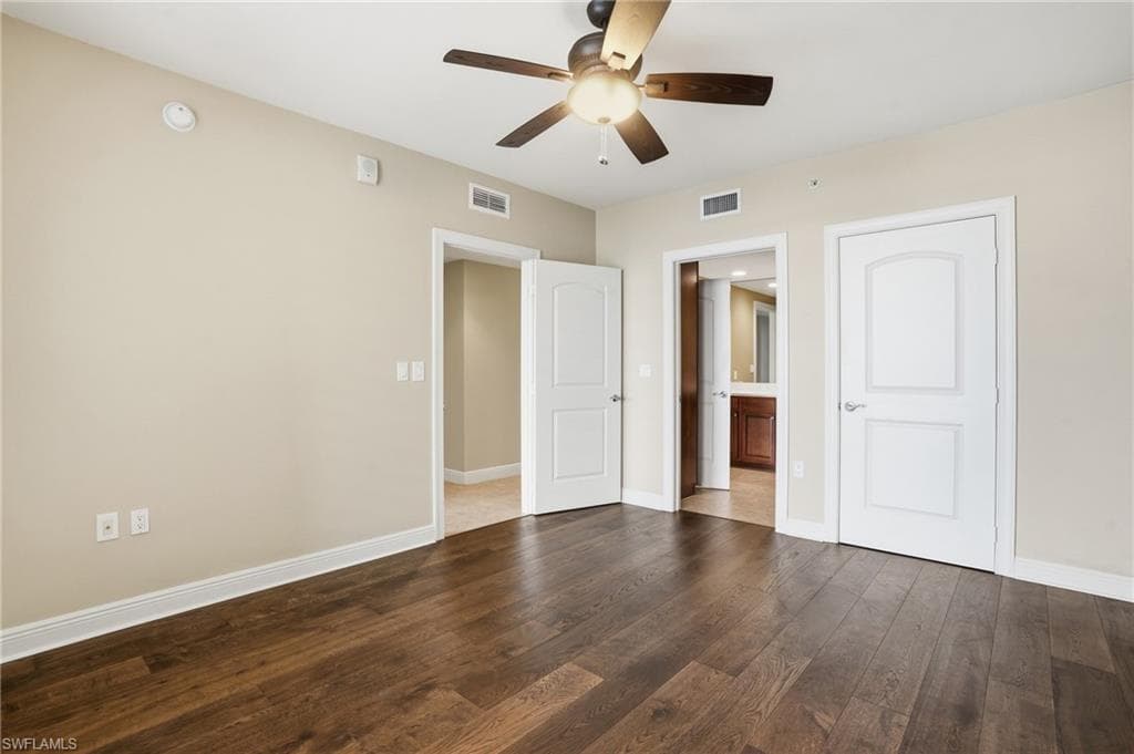 2nd bedroom featuring hard wood flooring, ceiling fan, and a closet