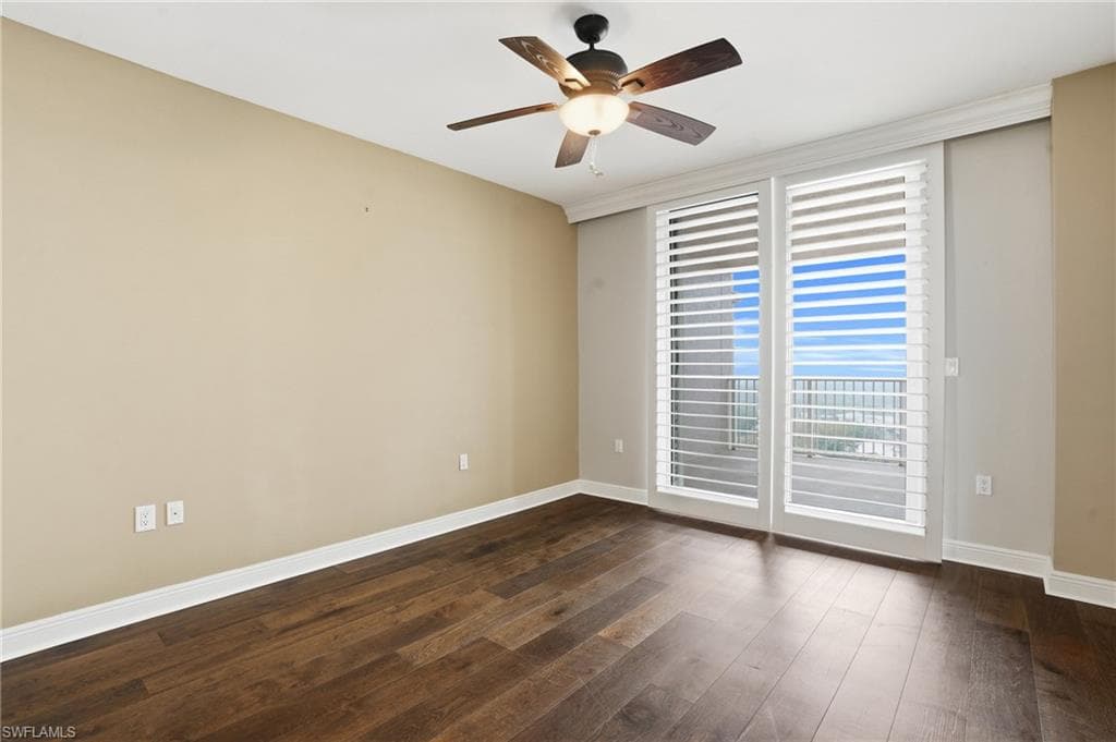 2nd bedroom featuring hard wood flooring, ceiling fan, and a closet