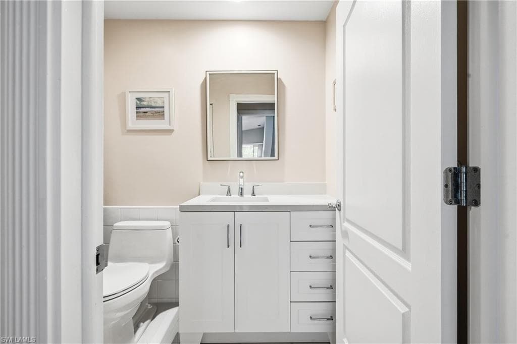 Refreshed guest bath, bright and current with comfort height cabinetry