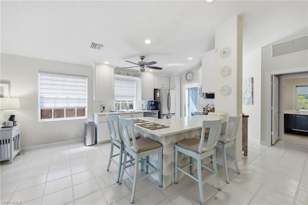 Spacious kitchen connecting seamlessly to dining and living areas.