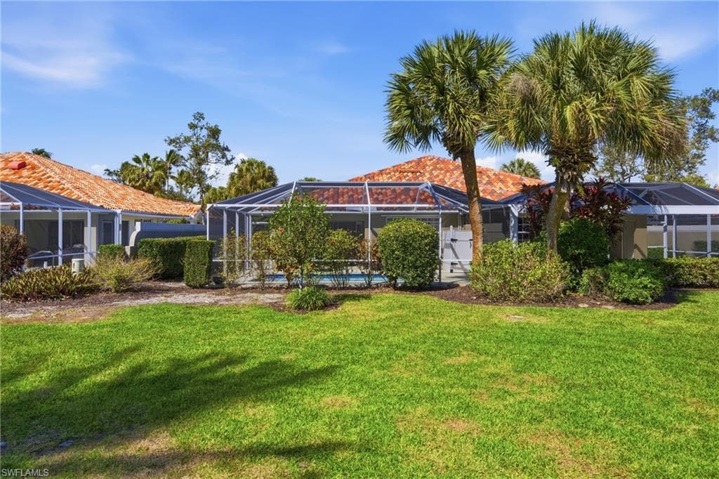 Private backyard setting surrounded by lush landscaping.