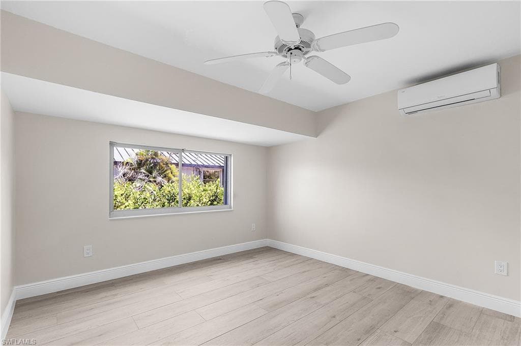 Unfurnished bedroom featuring ceiling fan and light wood-style floors