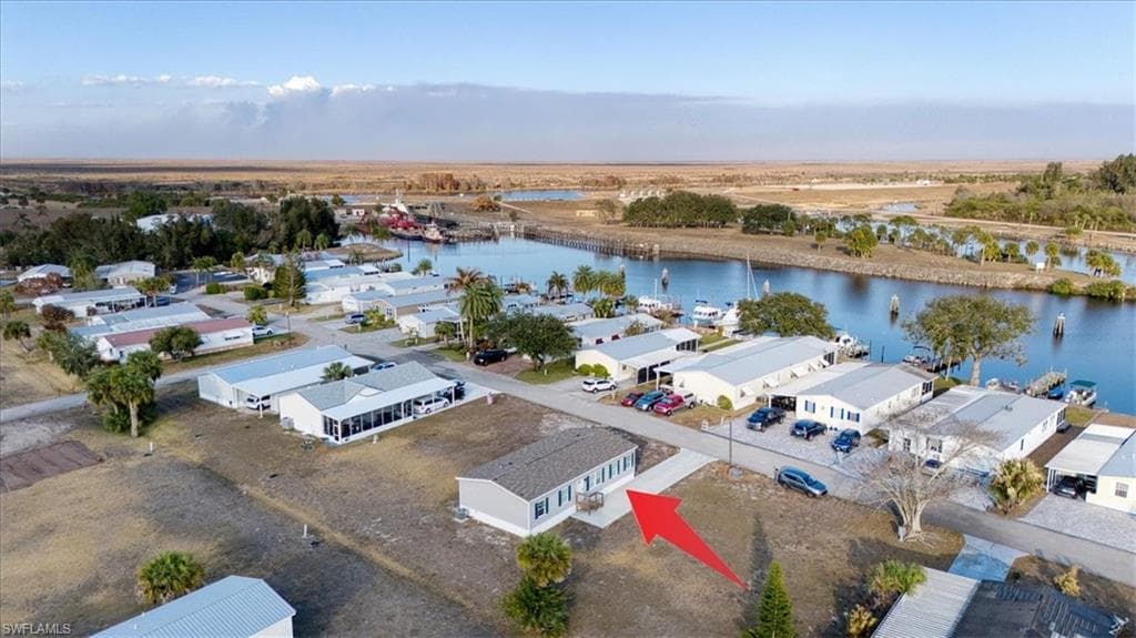 Aerial perspective of suburban area with a large body of water
