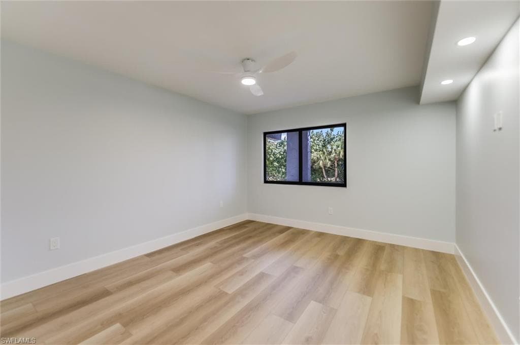 Empty room with recessed lighting, light wood-style flooring, and a ceiling fan