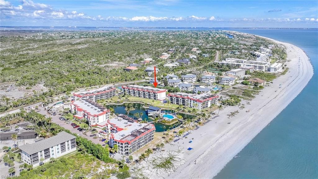 Bird's eye view of a large body of water and apartment complex / building