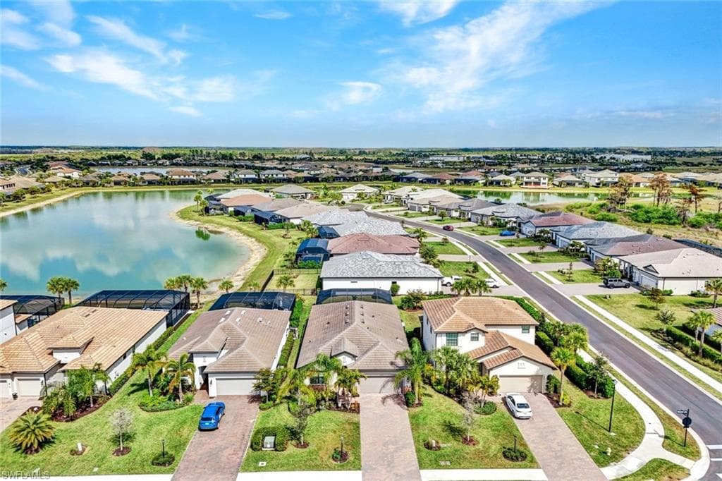 Aerial perspective of suburban area featuring a large body of water