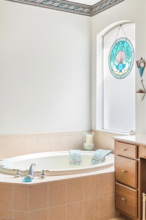 Full bath with a bath and vanity