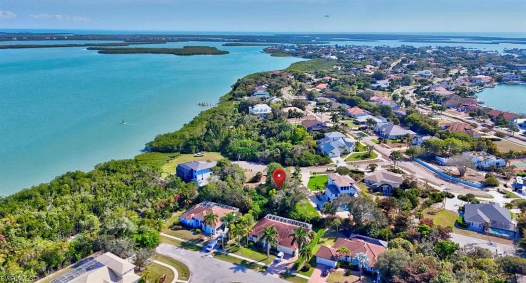 Aerial view of residential area with a large body of water