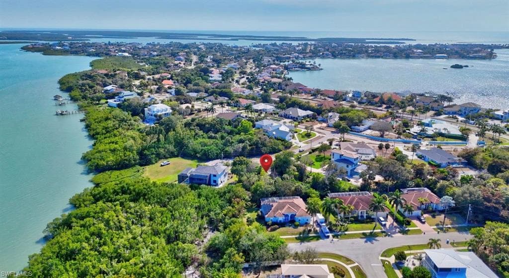 Aerial view of residential area with a nearby body of water