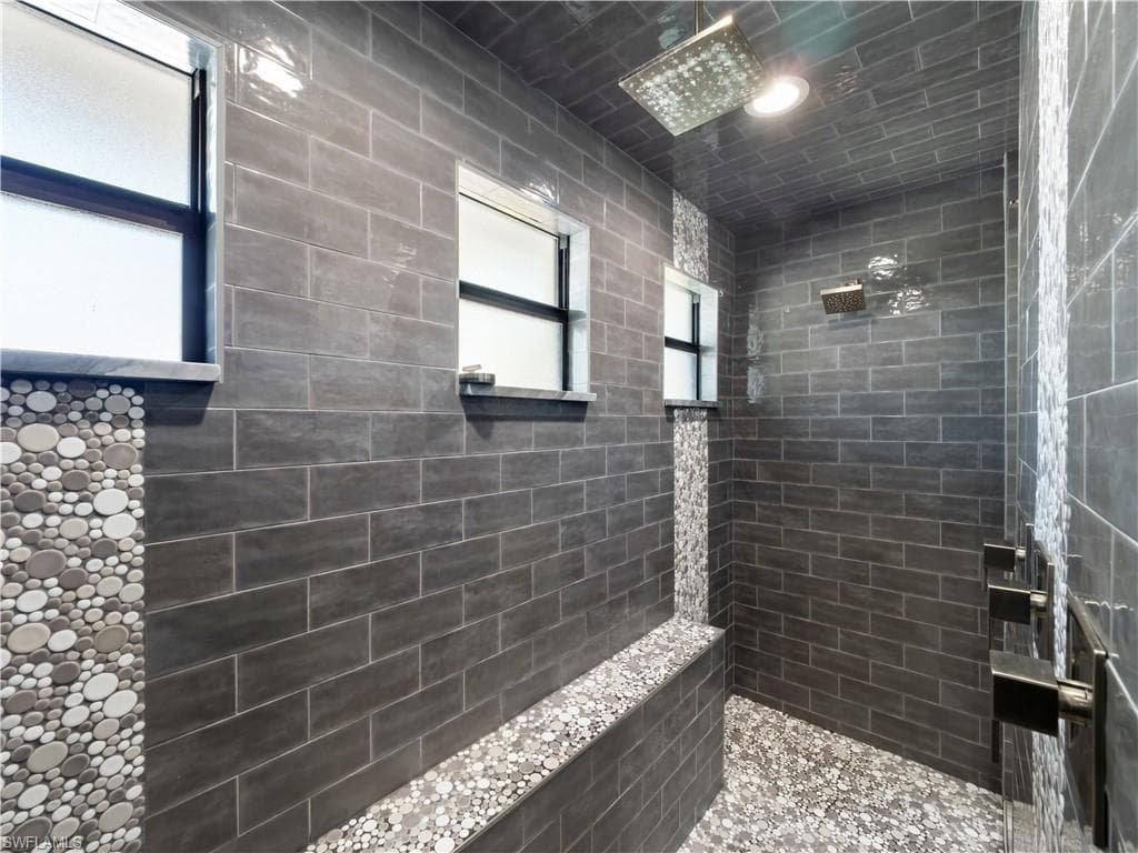 Bathroom featuring tiled shower