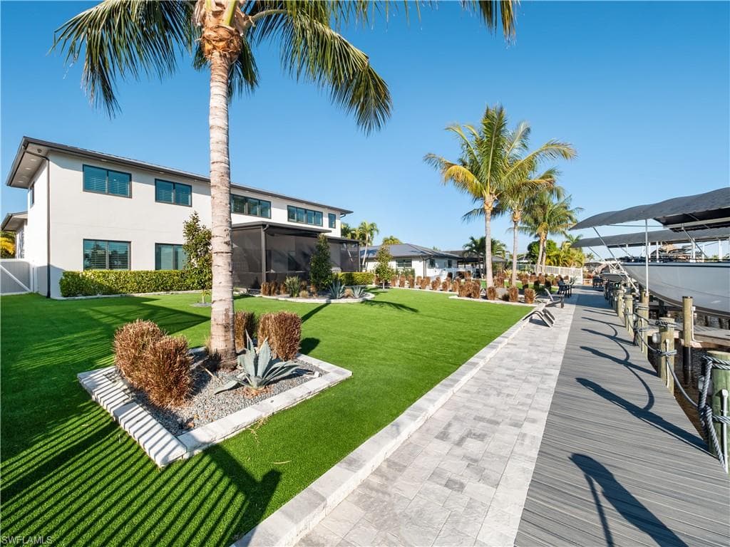 Dock area featuring a yard and a sunroom