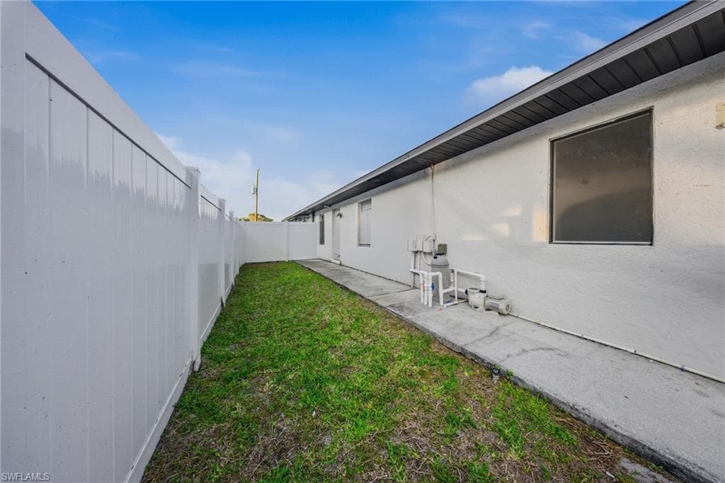 View of fenced backyard
