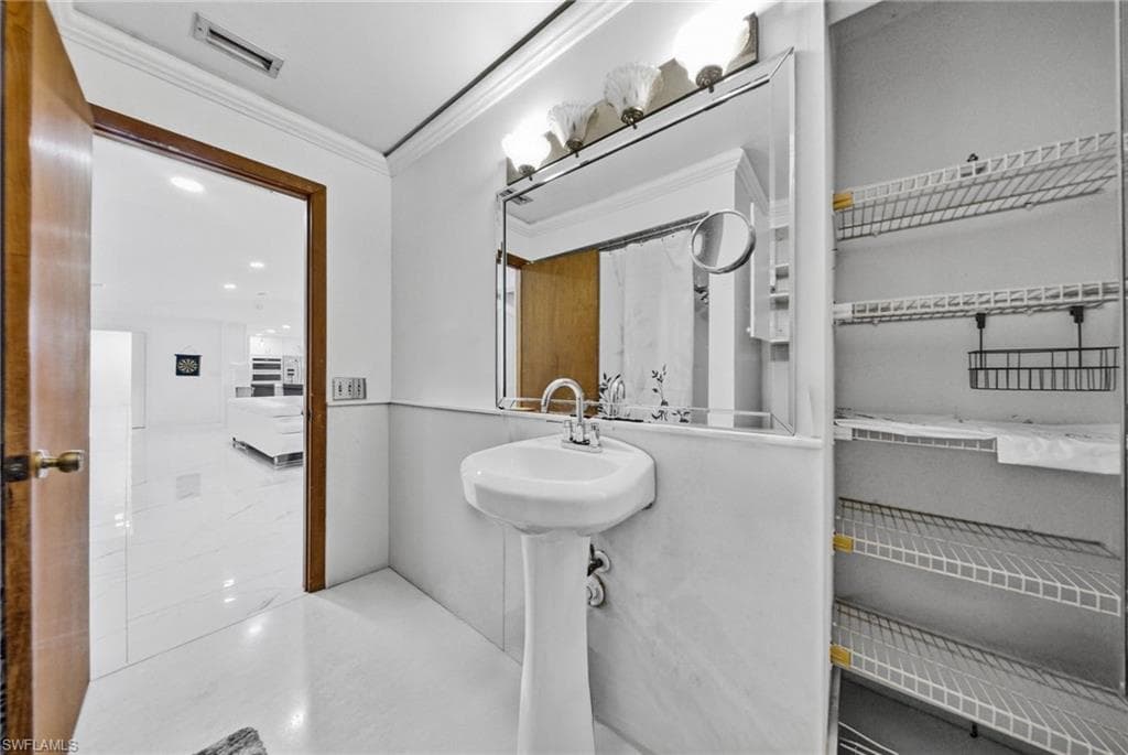 Bathroom featuring crown molding