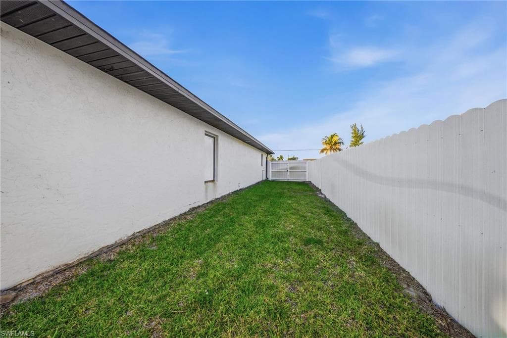 View of fenced backyard