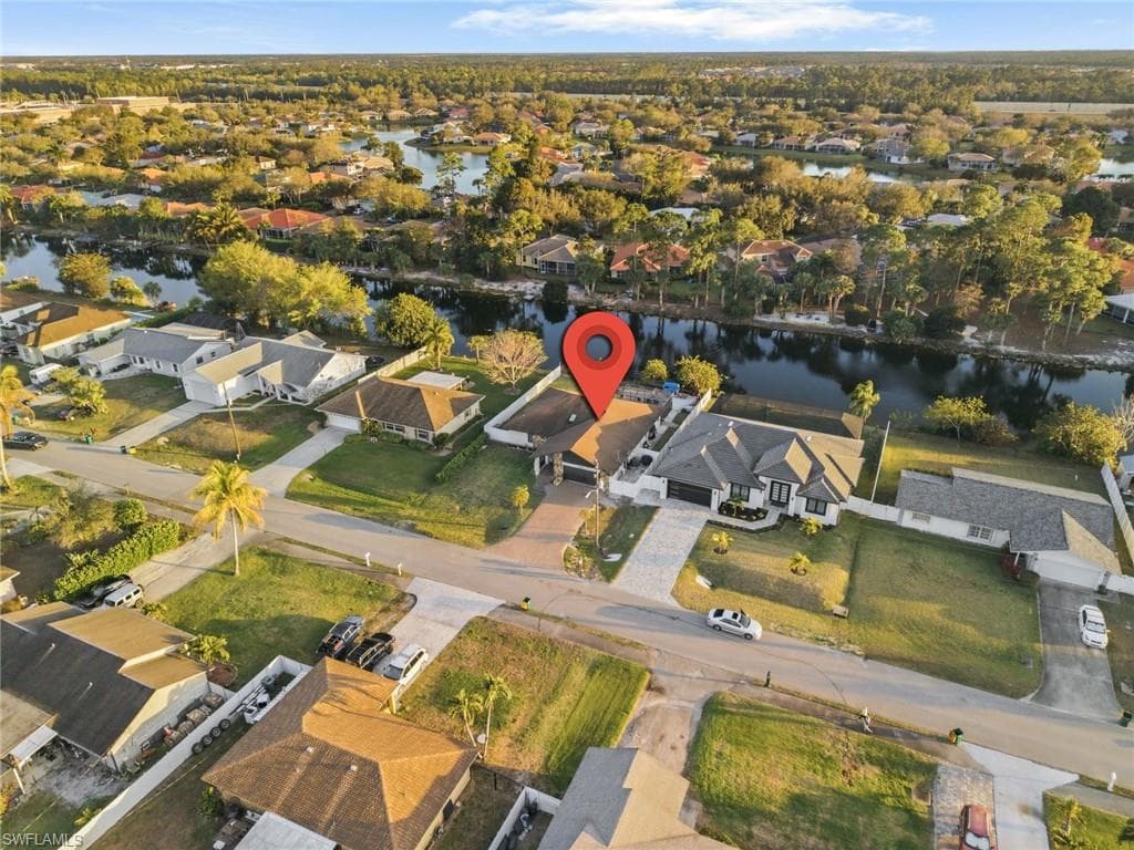 Aerial perspective of suburban area with a large body of water