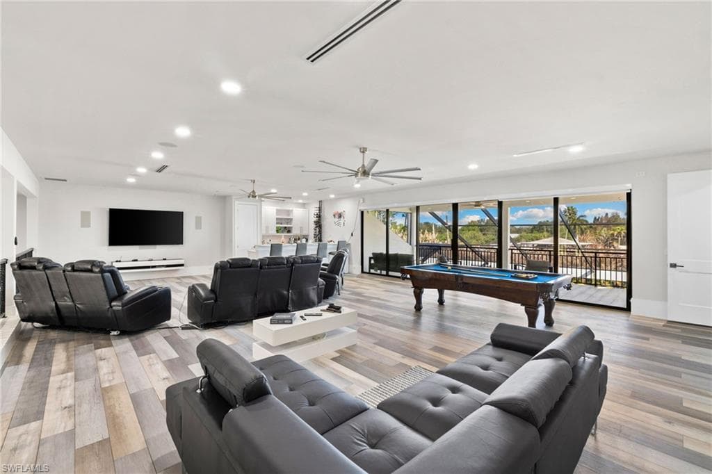 Living area featuring billiards, light wood finished floors, recessed lighting, and ceiling fan