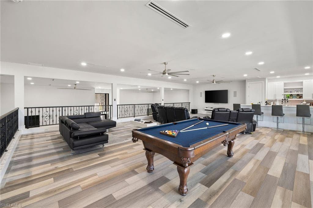 Playroom with a ceiling fan, billiards, recessed lighting, and light wood-type flooring