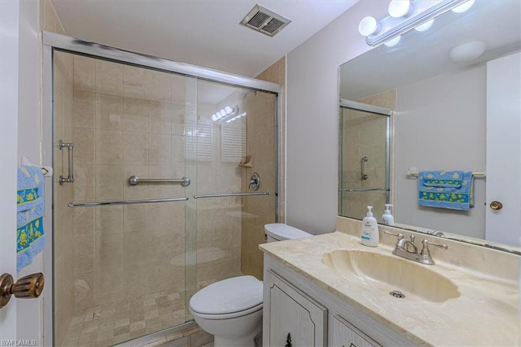 Guest Bathroom with vanity and a shower stall