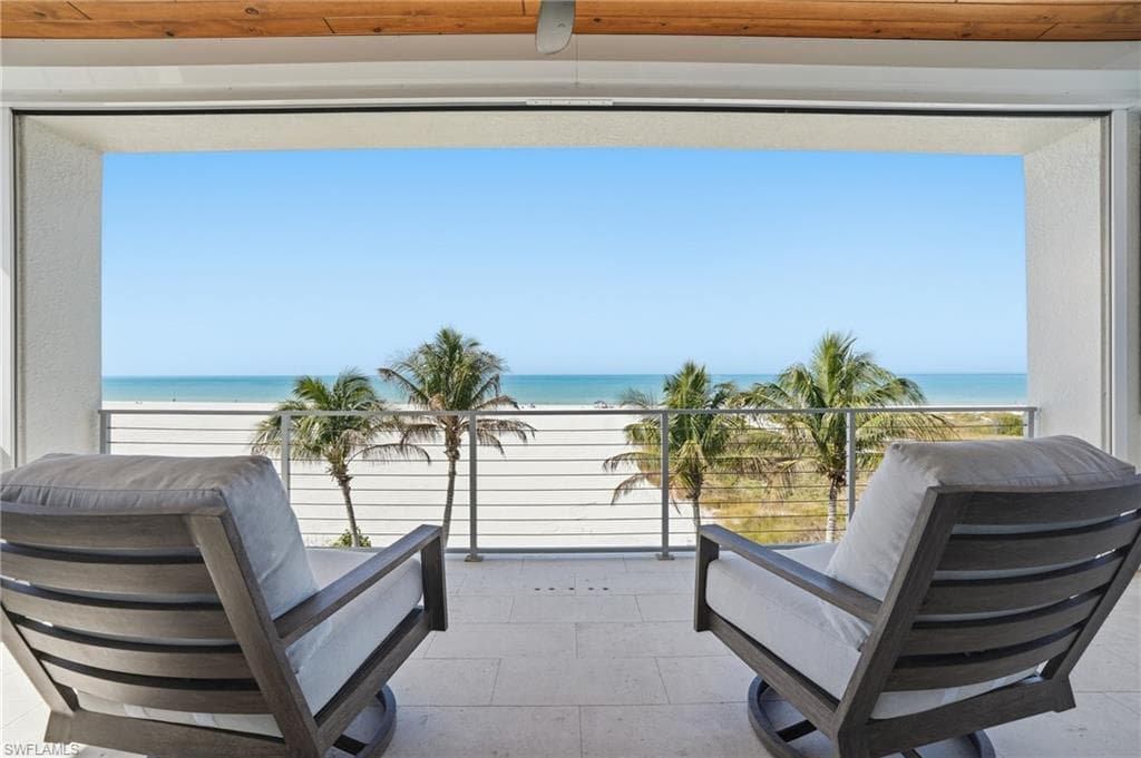 Balcony with view of water and beach - Virtually Edited Image