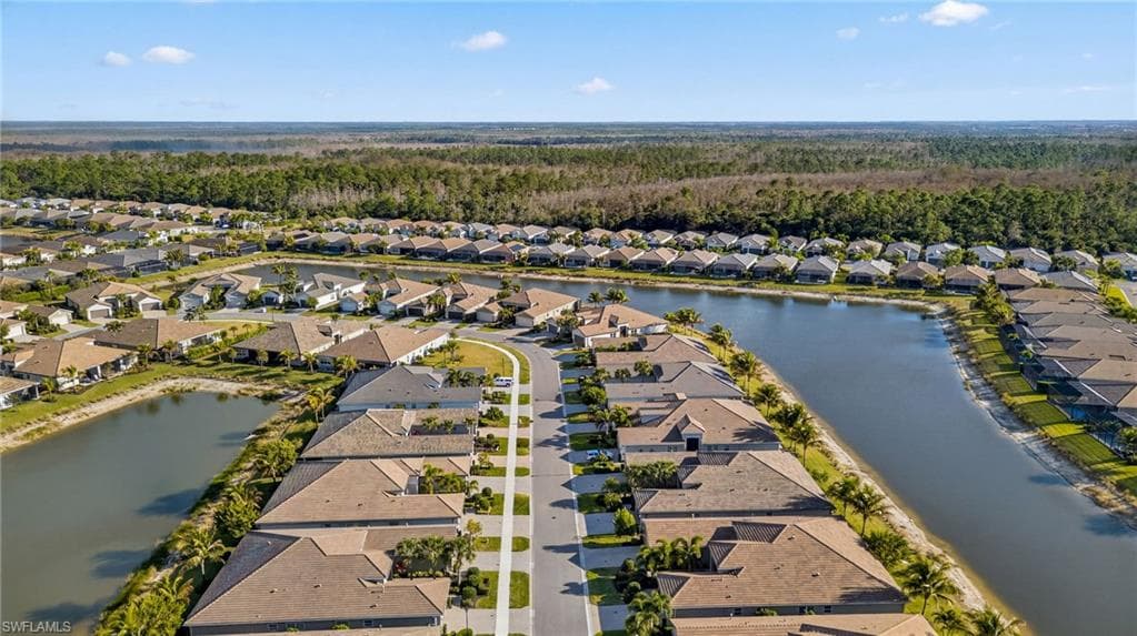 Aerial view of residential area with a large body of water