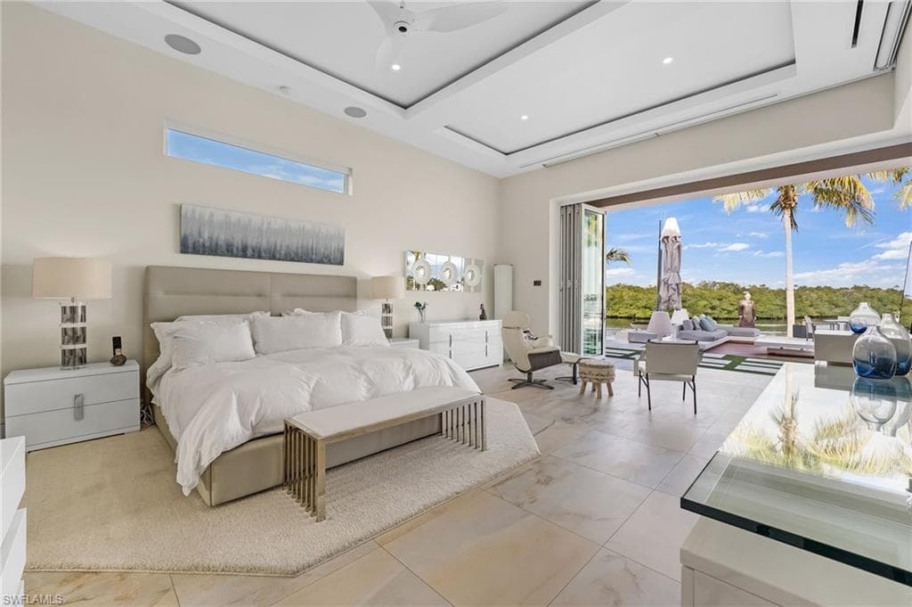 Designed for ultimate comfort and sophistication, the primary suite offers ethereal cloud lighting and striking 12-foot accordion hurricane doors that elevate the living experience.