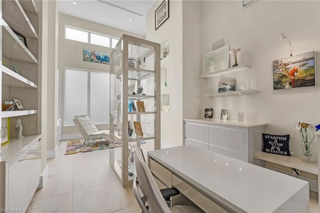 This versatile space is currently envisioned as an art gallery and private retreat, yet offers endless possibilities—ideal for an additional office, cozy seating area, or an elegant reading room tailored to your lifestyle.