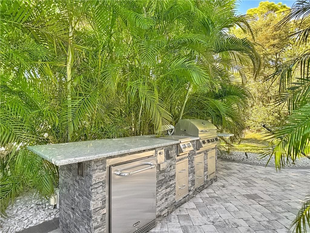 View of patio / terrace featuring exterior kitchen