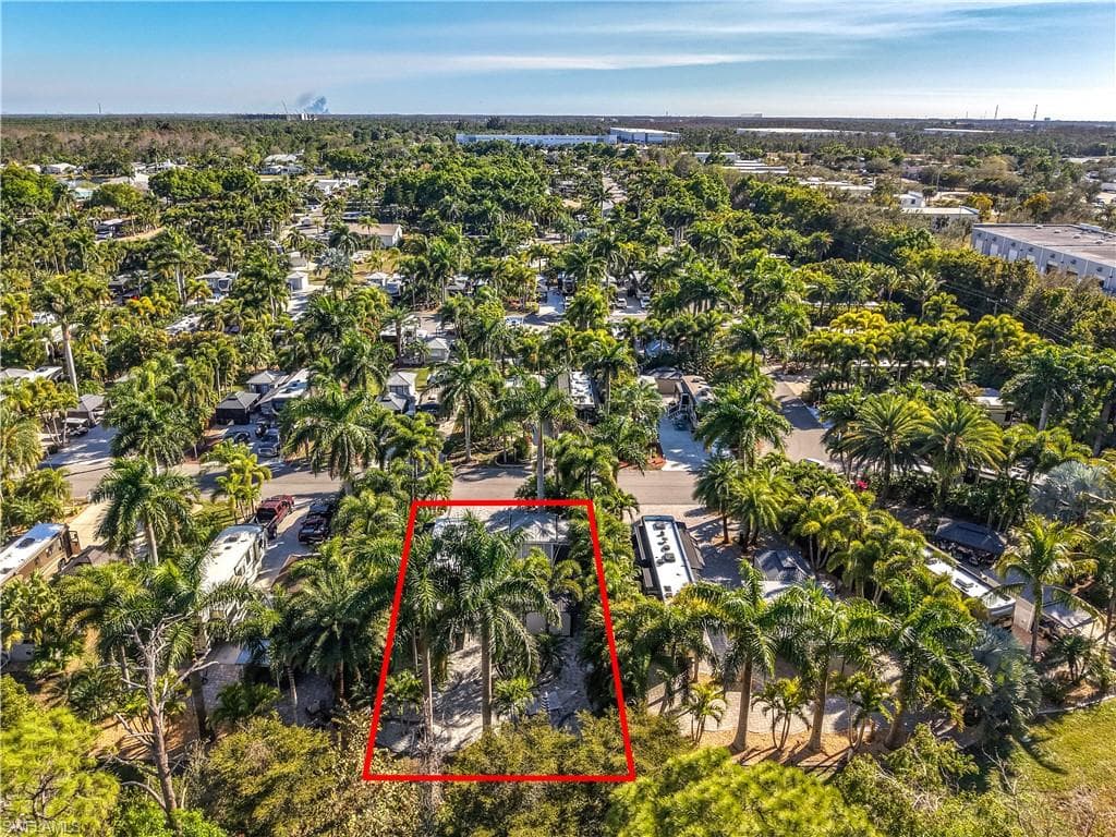 Aerial view of residential area featuring property boundaries highlighted