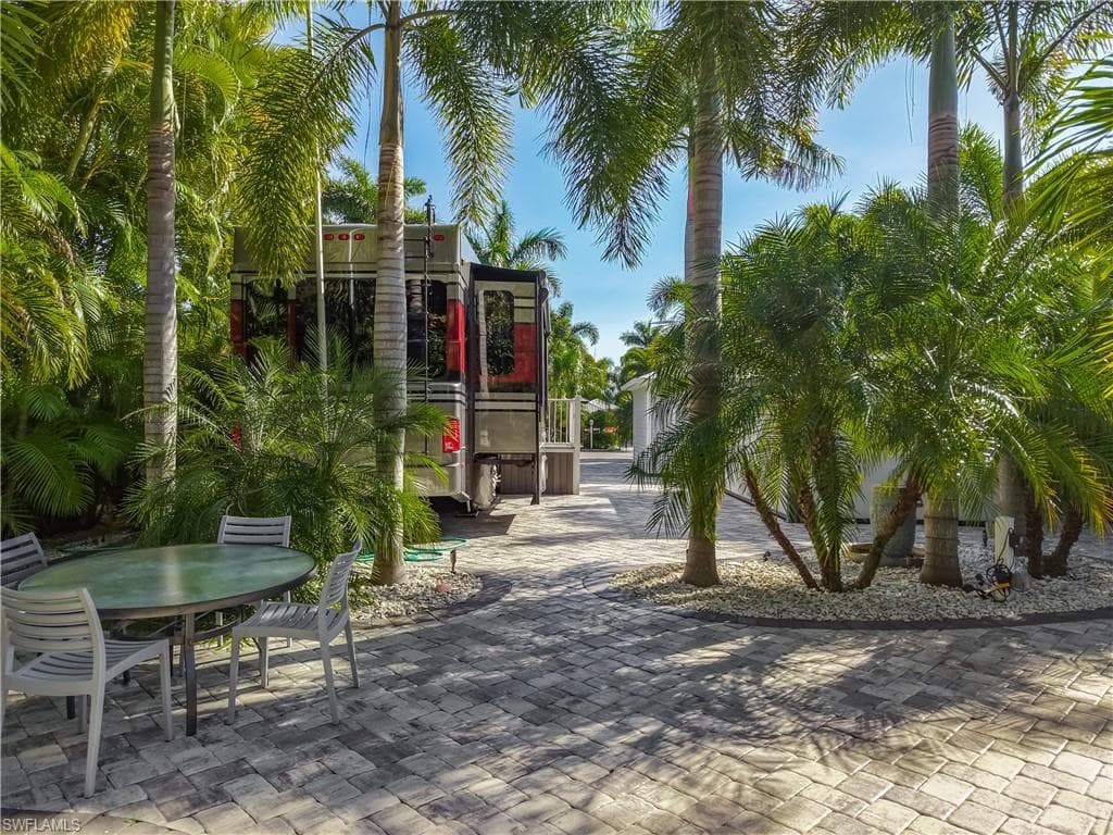 View of property's community with outdoor dining area