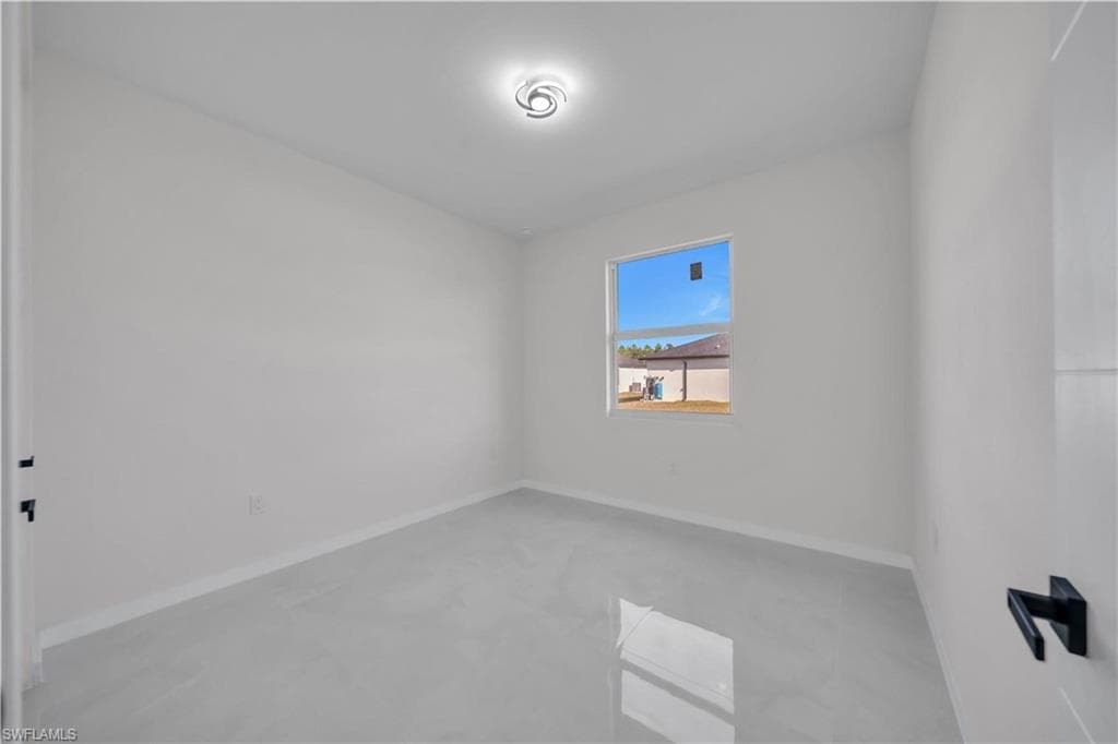 Empty room with baseboards
