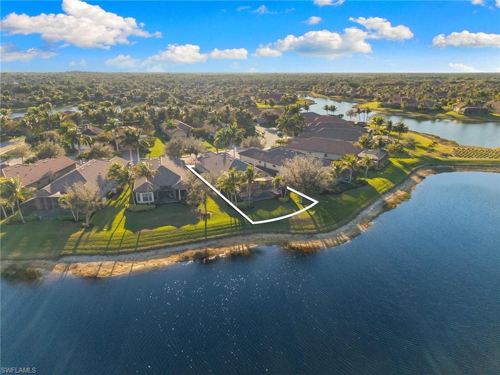 Aerial perspective of suburban area with a nearby body of water