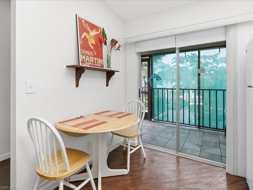 Dining room with dark wood finished floors