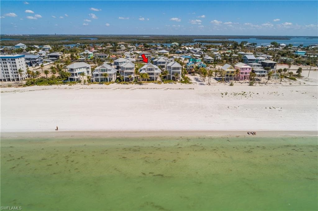 Aerial view of residential area with expansive beach