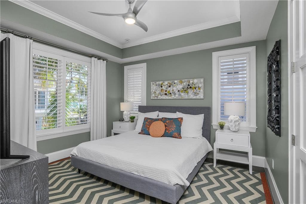 Bedroom with crown molding and ceiling fan