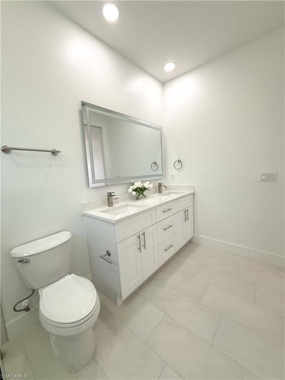 Master Bathroom featuring double vanity and recessed lighting