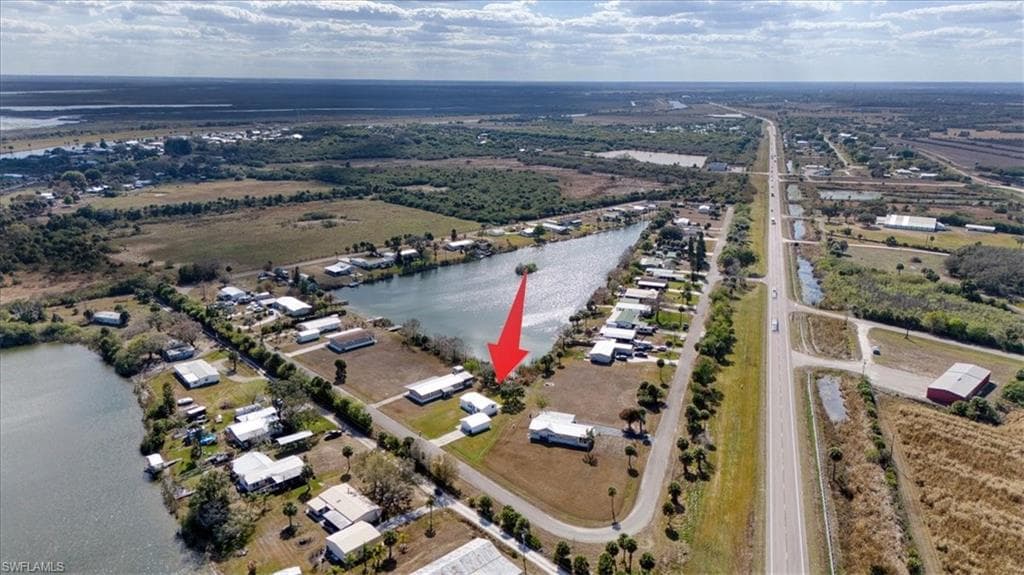 Aerial overview of property's location featuring a large body of water