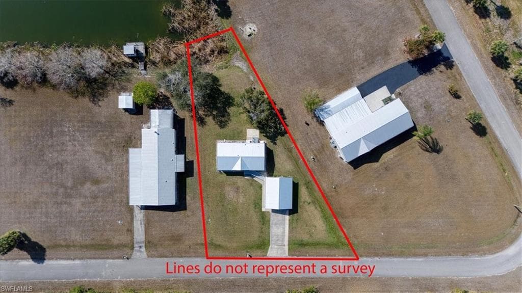 Aerial view of property and surrounding area with property boundaries highlighted