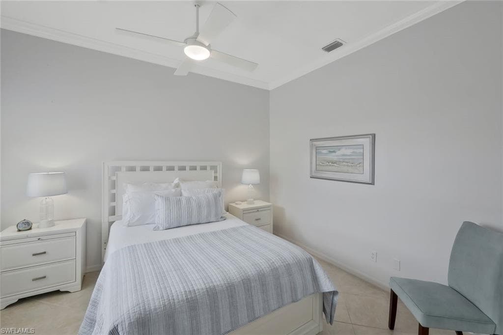 uest bedroom with high ceilings and abundant natural light creating a welcoming retreat for visitors.