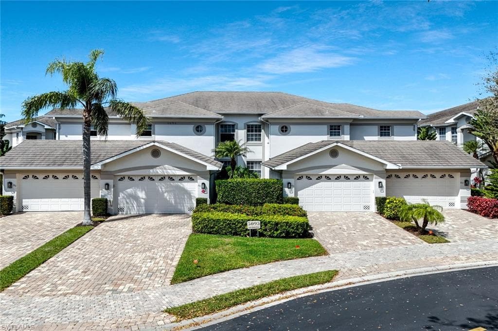 Attached two car garage providing secure parking and additional storage space.