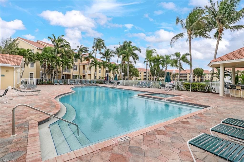 Community pool featuring a patio area