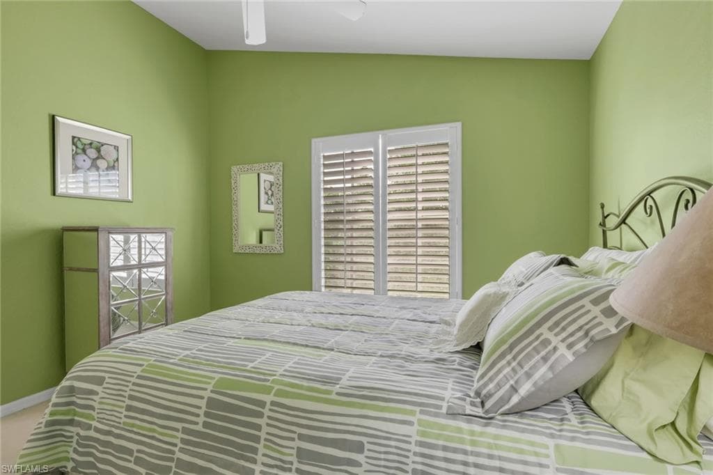 Bedroom featuring plantation shutters