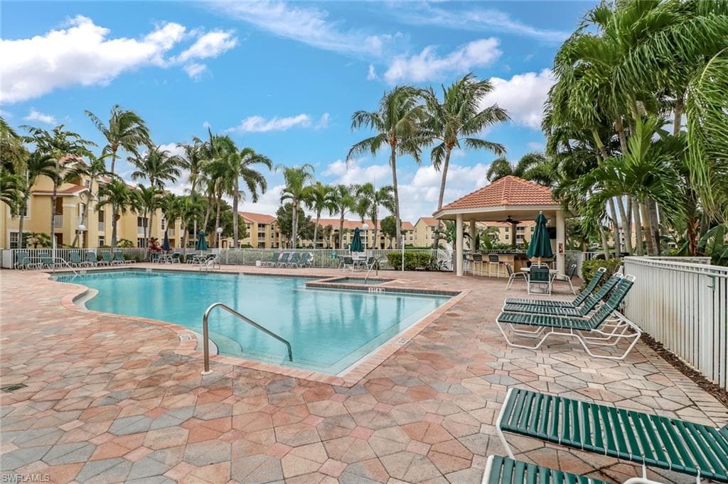 Community pool with a gazebo and a patio