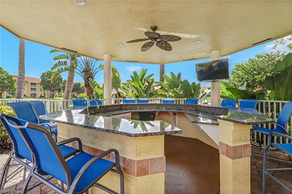 View of patio with a ceiling fan