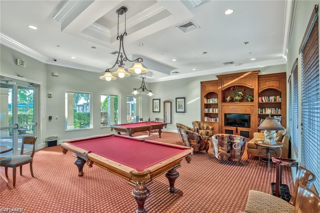 Playroom with billiards table, crown molding, recessed lighting, and a fireplace